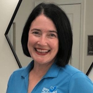 Amy Tuggle, a white woman with short black hair.