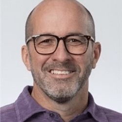 Damon Sullivan, a white man with a beard and glasses.