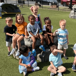 Children on grass outside.