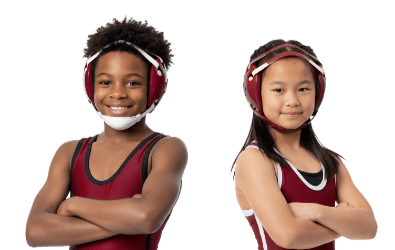 Boy and girl in wrestling uniforms.