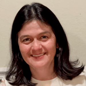 Helena Guzman, a woman with black hair.