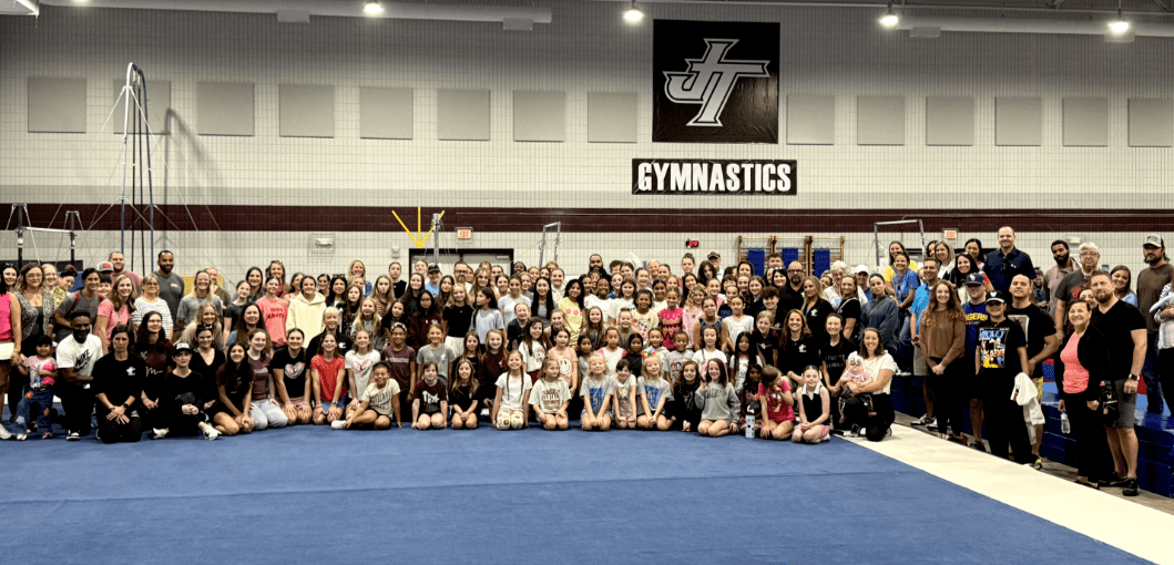 Full JT Gymnastics team and parents in the gym.
