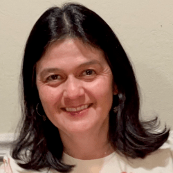 Helena Guzman, a Latina woman with brown hair.