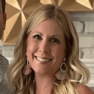 Laura Teal, a white woman with long blonde hair.