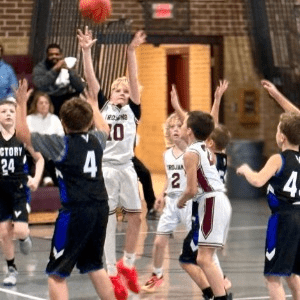 Player shooting a basket during a game
