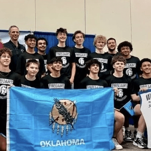 Jenks Trojan Boys Volleyball team holding Oklahoma flag.