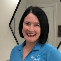 Amy Tuggle, a white woman with short black hair.